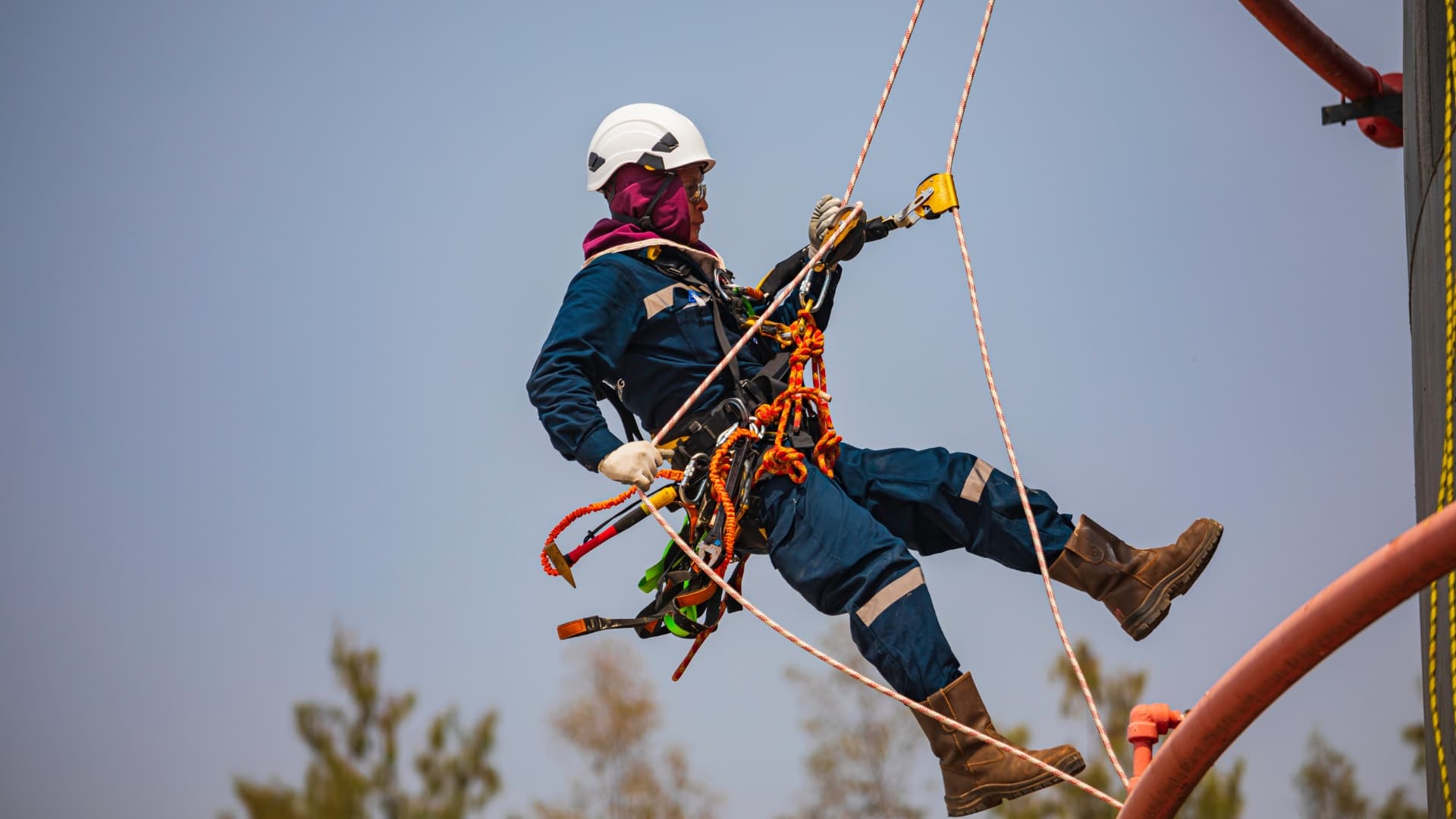 Rope access technician working at height